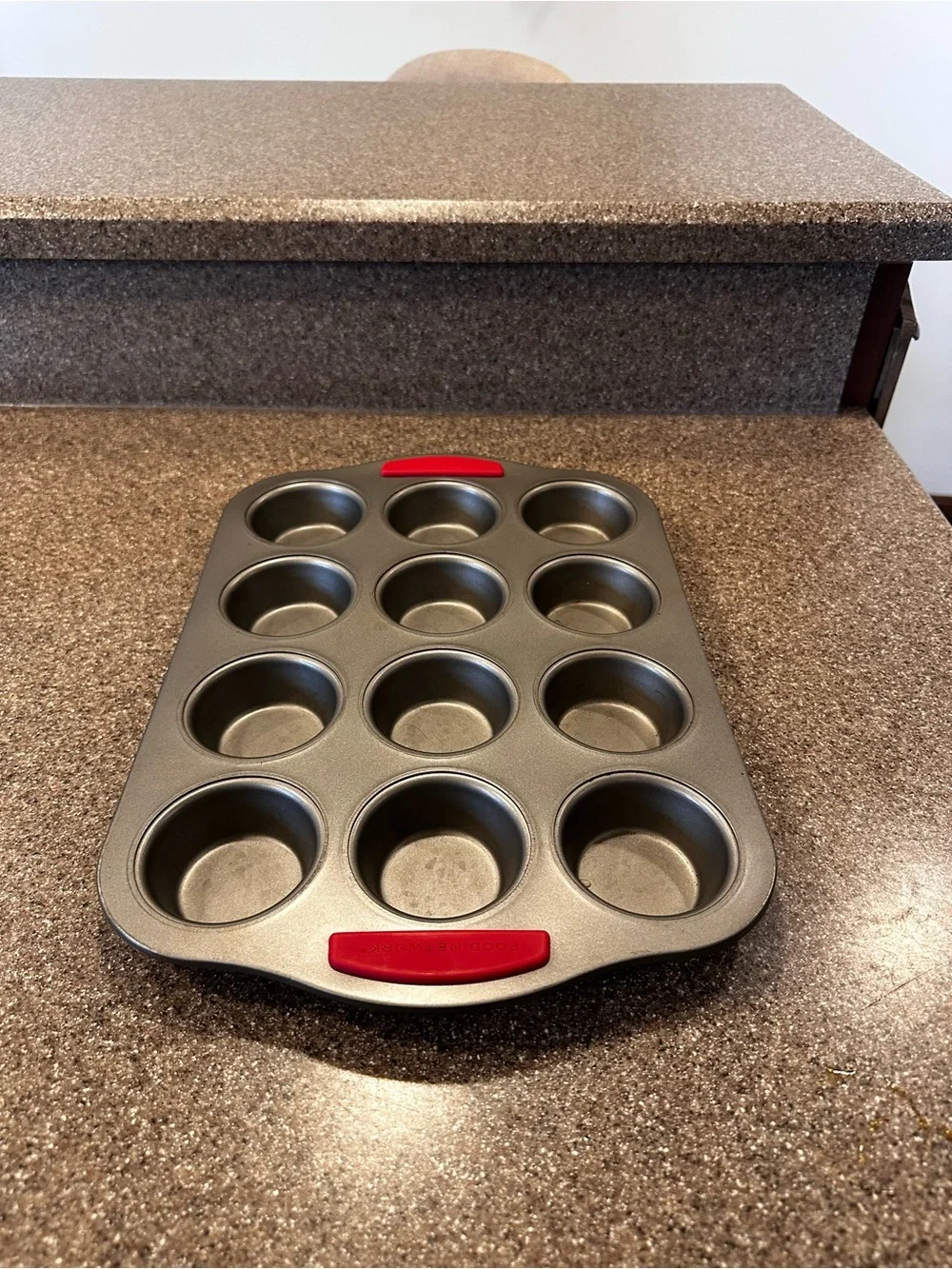 Food Network 12-Cup Gray Muffin Pan with Red Silicone Grips